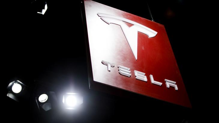 Tesla stock rallies after company swings to profit, sales more than double