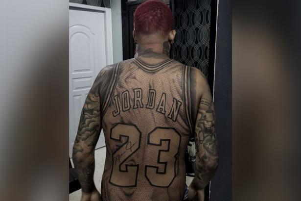This guy got a full-size Michael Jordan jersey tattoo on his body
