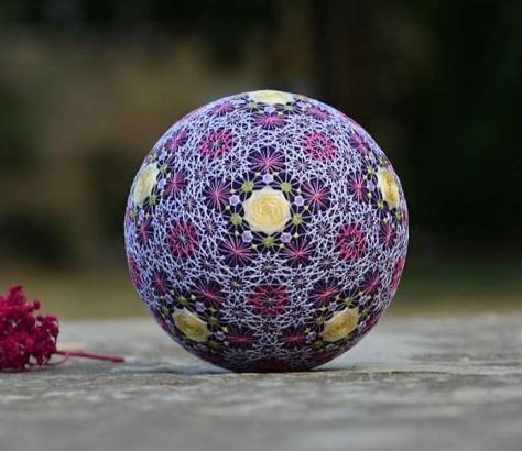 Artist's embroidered temari balls are handmade geometric wonders