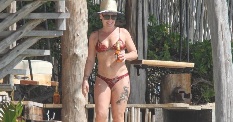 Pink Kicks Back and Relaxes With a Beer During a Romantic Beach Getaway With Carey Hart