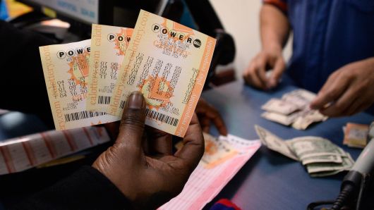 There's a huge tax bill if you hit the $348 million Powerball or $267 million Mega Millions jackpot