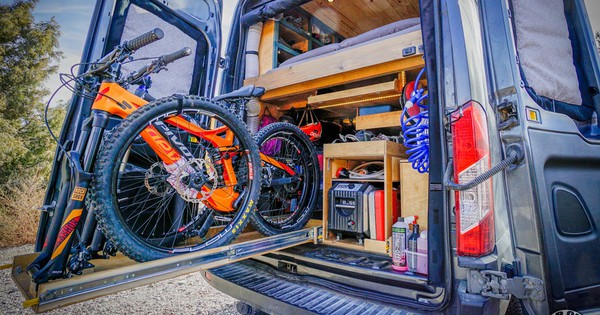 Adventurous couple's van conversion packs in a lot of outdoor gear (Video)