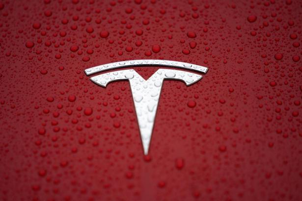 Tesla promises return to profit after first-half losses