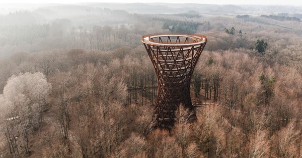 Spiral observation tower rises out of Danish forest