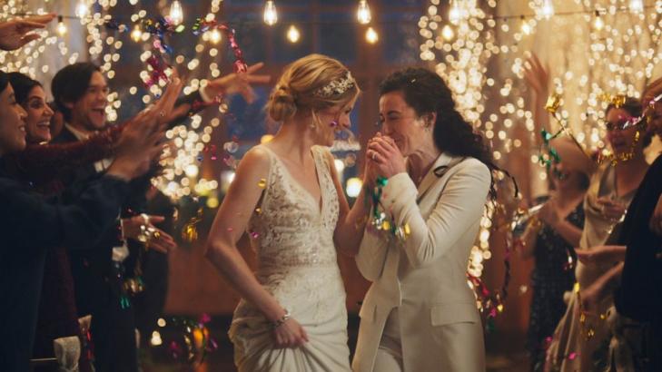 Under pressure, Hallmark pulls gay-themed wedding ads