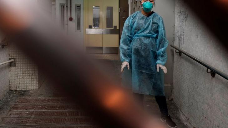 China's daily death toll from virus tops 100 for first time