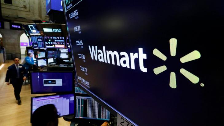 Walmart revises leave policy in face of virus; worker tests