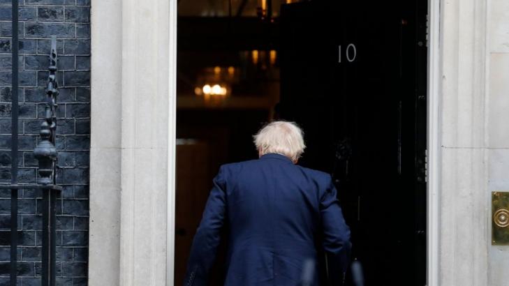 Back at work, Boris Johnson urges patience over UK lockdown