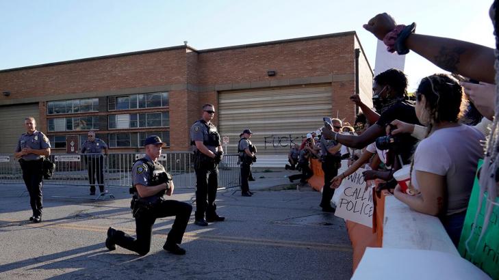 Oklahoma deputies take a knee in solidarity, hug protesters demanding justice for George Floyd
