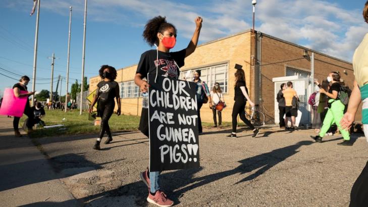 Summer school protesters arrested after trying to block buses