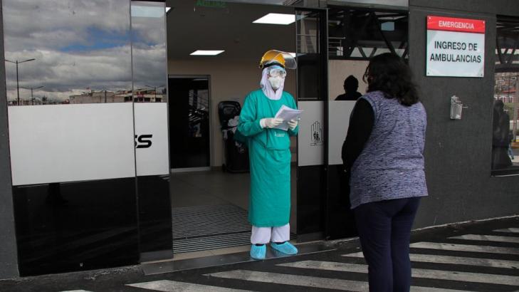 Hundreds wait hours for coronavirus care in Ecuador capital