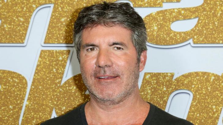 Simon Cowell injures back while testing electric bicycle