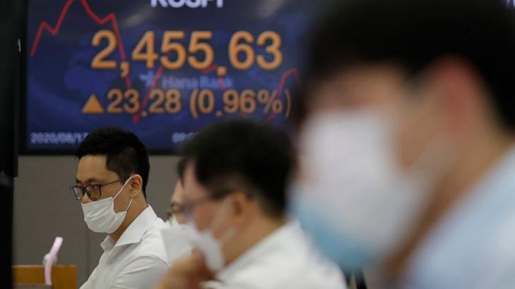 Asian shares mixed on weak China data, worries over pandemic