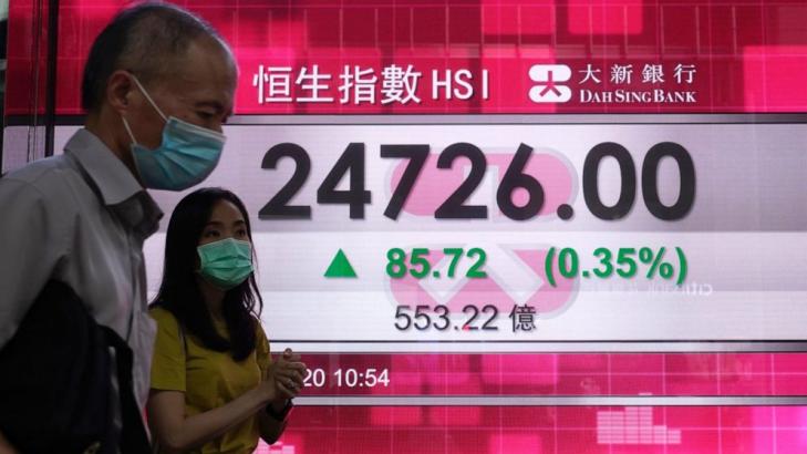 Asian markets mixed after Wall Street rises on dealmaking