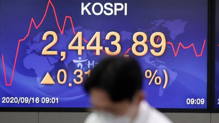 Asian shares mostly higher after Wall Street gains