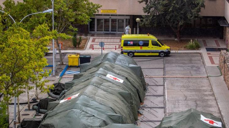 Emergency tents, restrictions back as virus spikes in Madrid