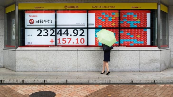 Asian shares mixed, cheered by US rally, stimulus hopes