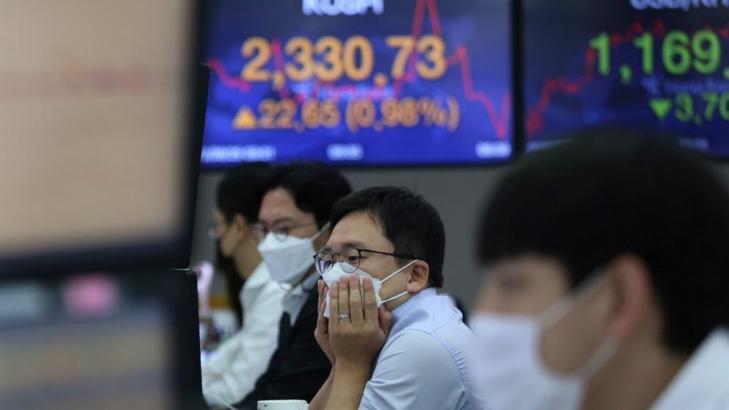 Asian stocks mixed after Wall St rally ahead of US debate