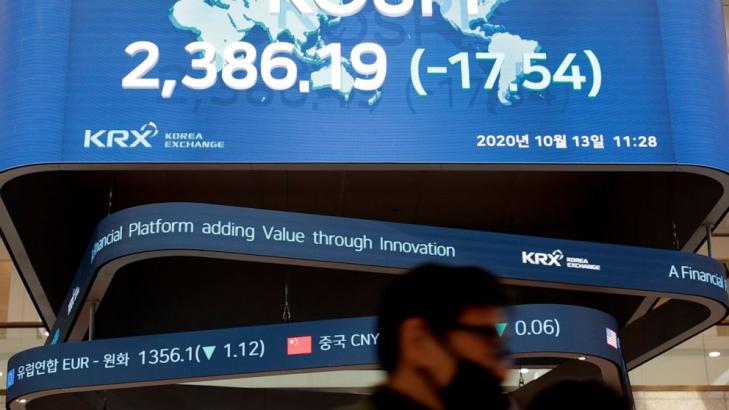 Asian shares mixed as China reports faster growth in trade