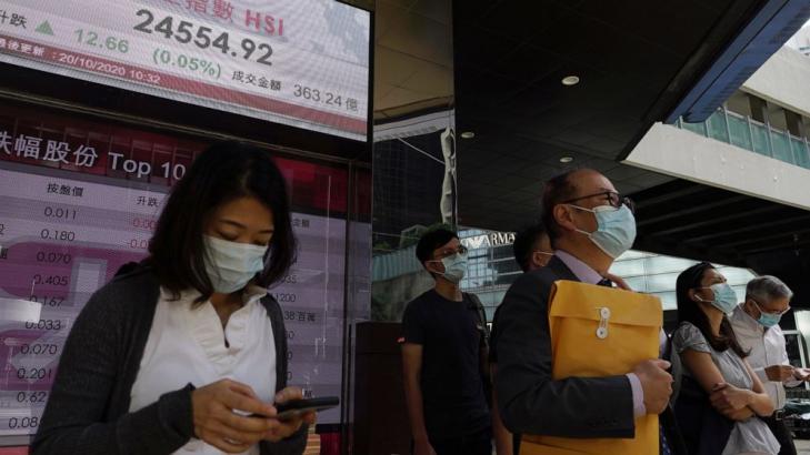 Asian shares mixed as U.S. virus aid hopes fade