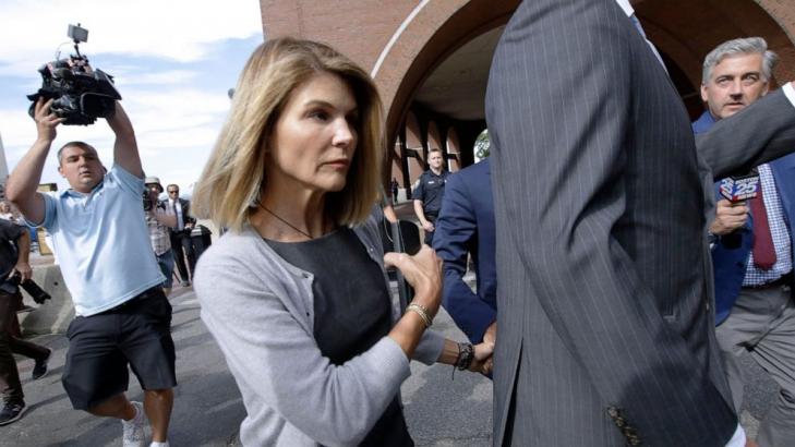 Actress Lori Loughlin reports to prison in college scam