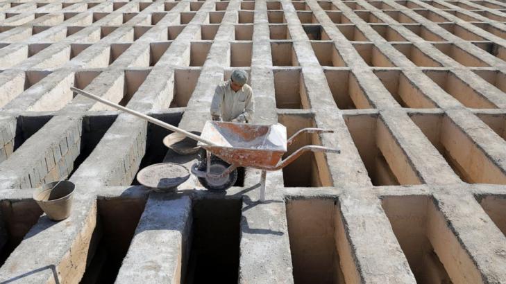 In Iran, a massive cemetery struggles to keep up with virus