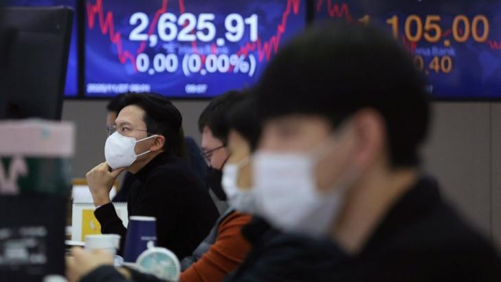 Asian stocks fall amid unease about vaccine development