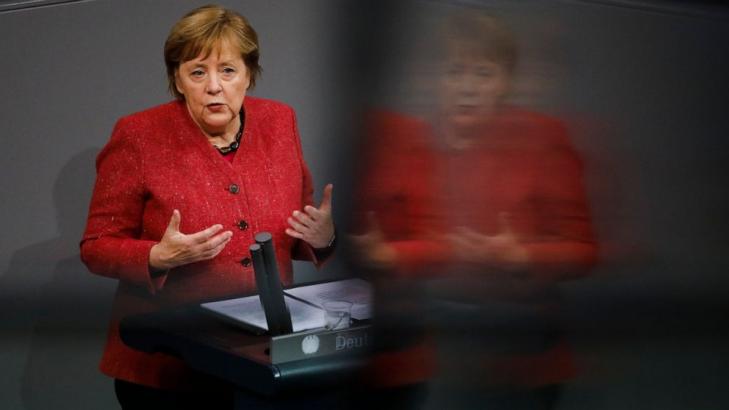 Merkel backs tougher virus curbs as German deaths hit record