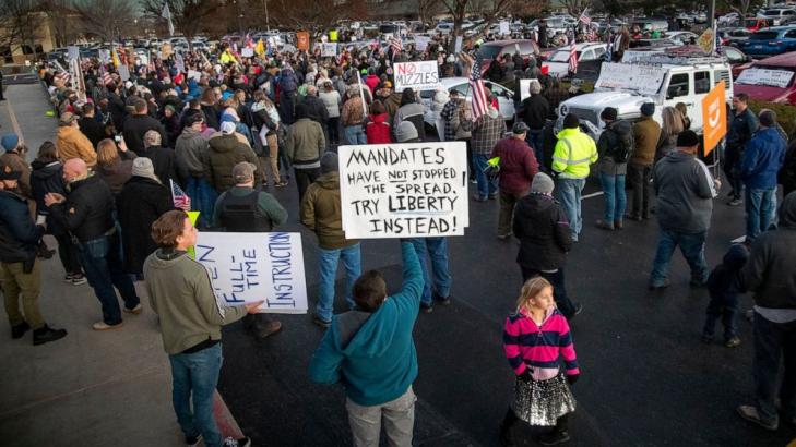 Tensions rise over masks as virus grips smaller US cities