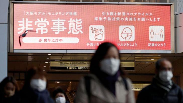 Japan widens virus emergency to 7 more areas as cases surge