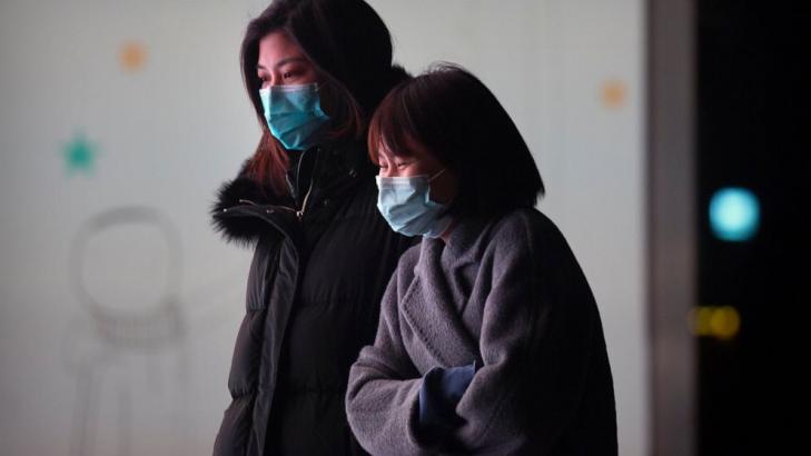 Asia Today: China virus cases spike as WHO researchers visit