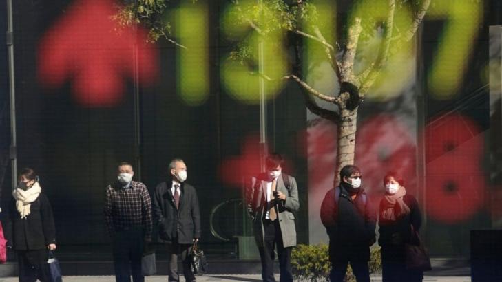 Japan shares fall on pandemic worries as rest of Asia rises