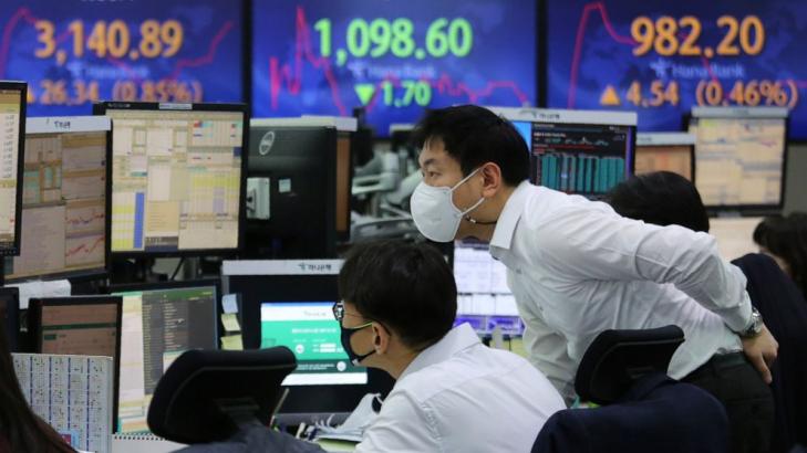 Asian shares mostly up on optimism for stimulus from Biden
