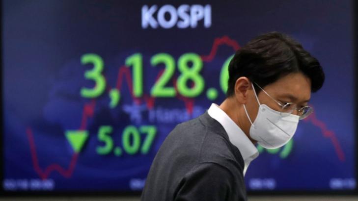 Asian shares mostly lower after mixed day on Wall Street