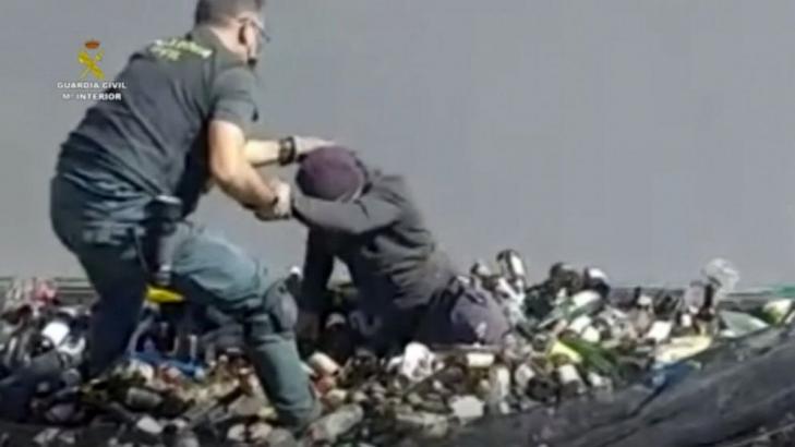 Europe-bound migrants found amid broken glass, toxic ash