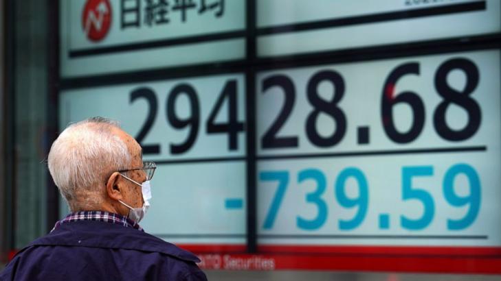 Asian shares sink, Tokyo down 4% after tech rout on Wall St
