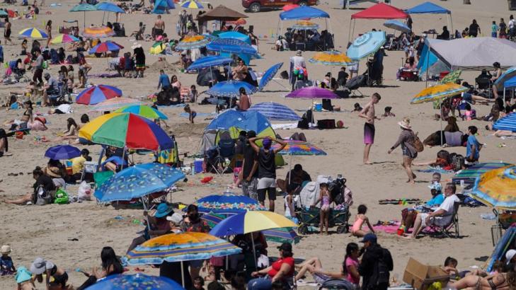Sun's out, surf's up and California's reopening more widely
