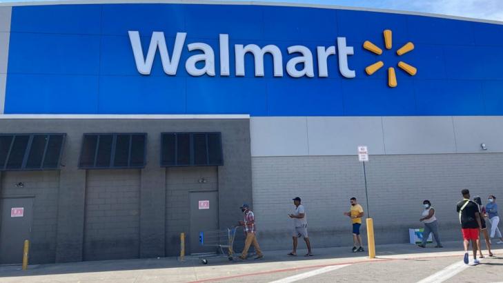 To retain workers, Walmart moves more of them full time