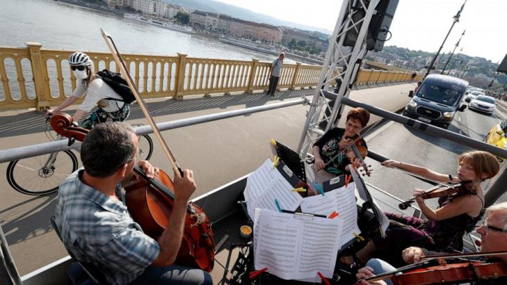 Budapest orchestra performs live concert from moving truck