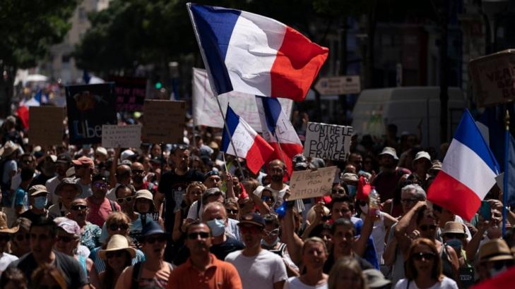 Protesters in France denounce COVID-19 health pass