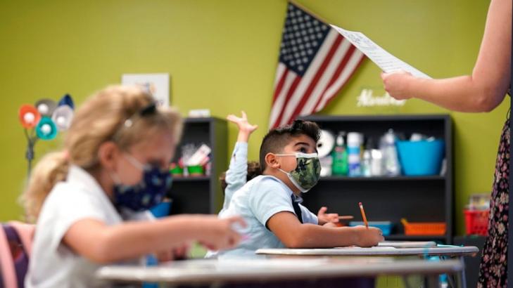 Florida mask debate split-screen: courtroom vs. classrooms