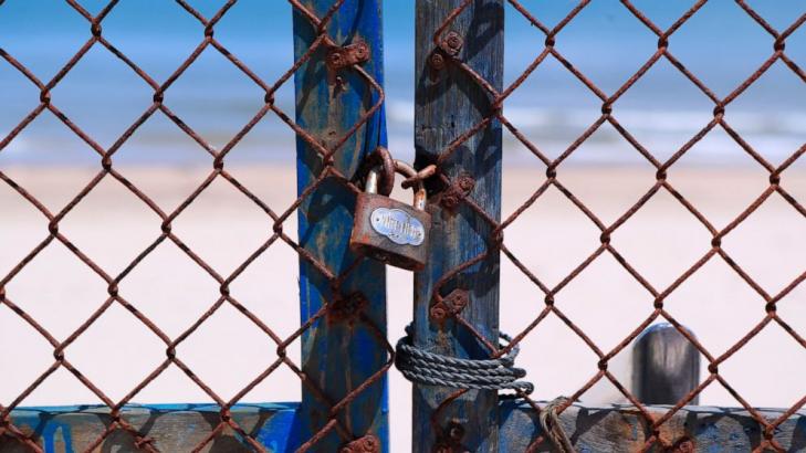 AP PHOTOS: Behind barricades, Vietnam battles 'enemy' virus