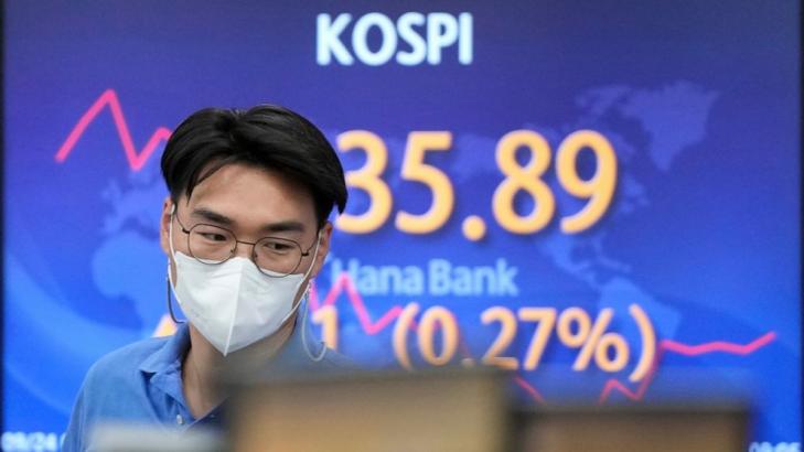 Japan jumps, rest of Asia down, on China and virus concerns