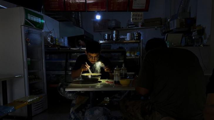 Chinese switch to flashlights, generators amid power cuts