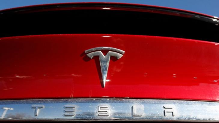 Tesla posts record profits as its deliveries soared in 2021