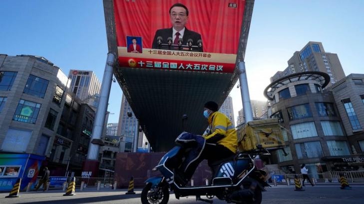 China cuts economic growth goal as it tries to reverse slump