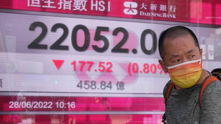 Asian shares mixed after wobbly day on Wall Street