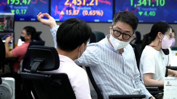 Asian shares mixed after modest Wall Street fall