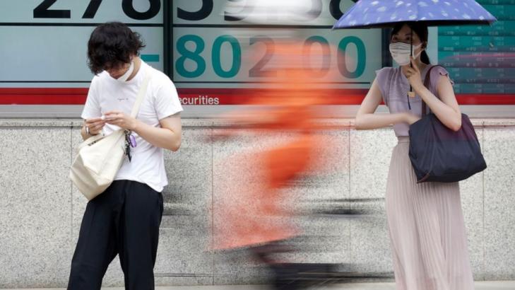 Asian shares slide on Wall Street drop that ended last week