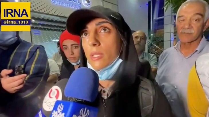 Iranian athlete returns to Tehran after competing overseas without hijab